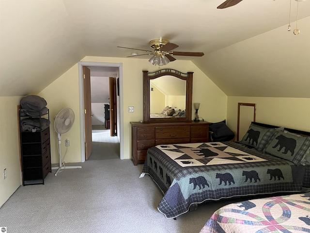 carpeted bedroom with ceiling fan and lofted ceiling