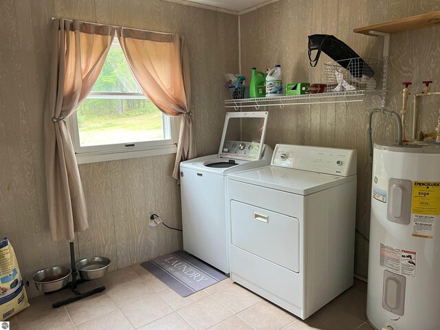 laundry area with separate washer and dryer and electric water heater