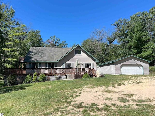 view of front of property with a garage, a deck, and a front yard