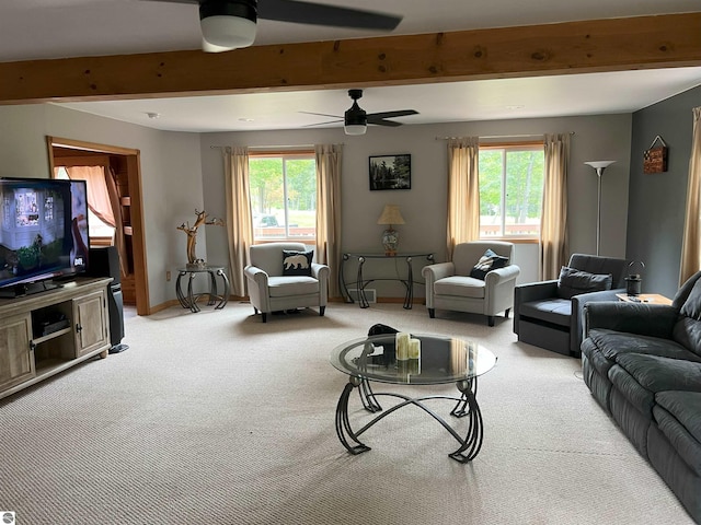 living room with plenty of natural light, ceiling fan, and light carpet