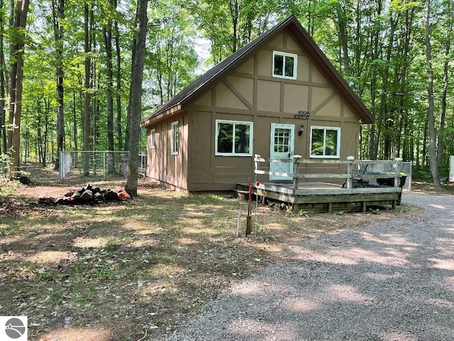 back of property featuring a wooden deck