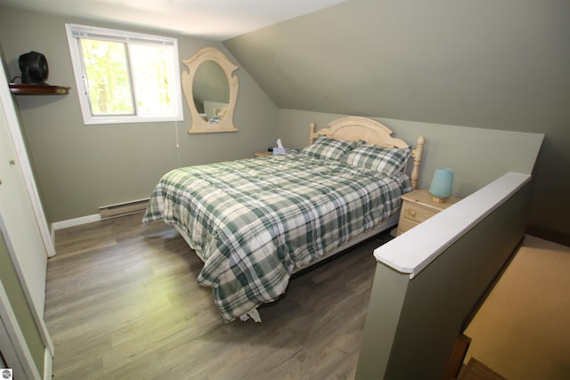 bedroom with vaulted ceiling, dark wood-type flooring, and a baseboard radiator