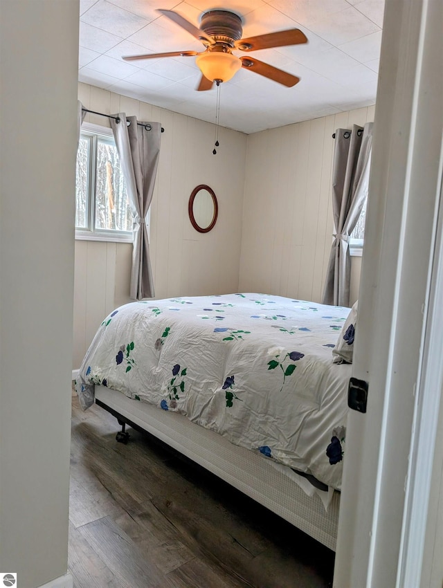 bedroom featuring hardwood / wood-style flooring and ceiling fan