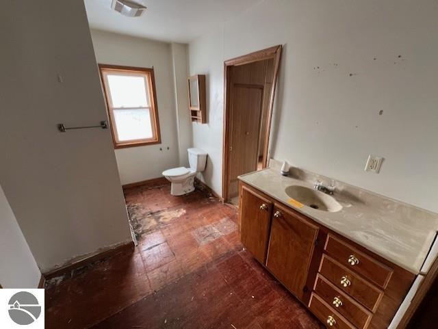 bathroom with vanity and toilet