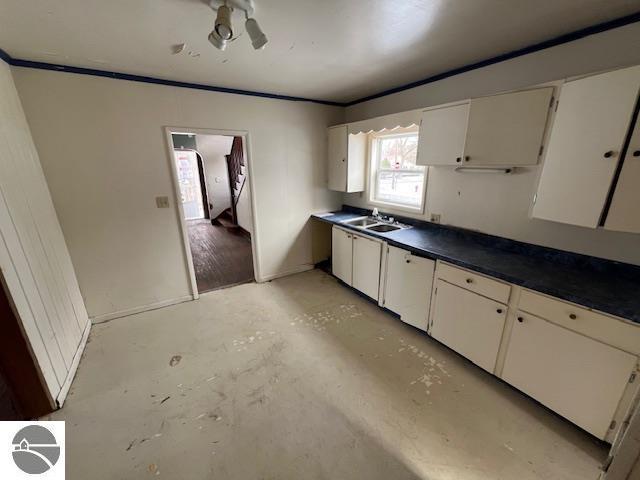 kitchen with sink and white cabinets