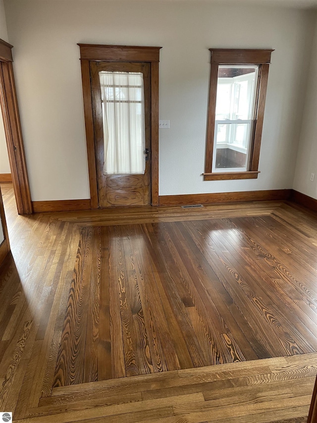 309 E Wisconsin, Mount Pleasant, MI 48858 - spare room featuring baseboards and wood finished floors