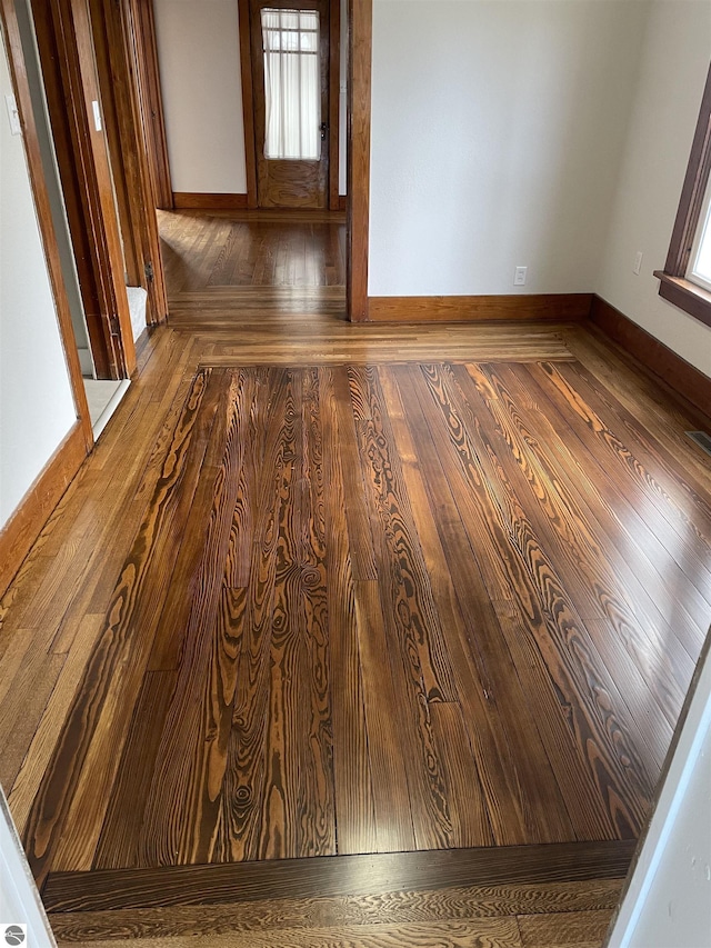 309 E Wisconsin, Mount Pleasant, MI 48858 - empty room with wood-type flooring and baseboards