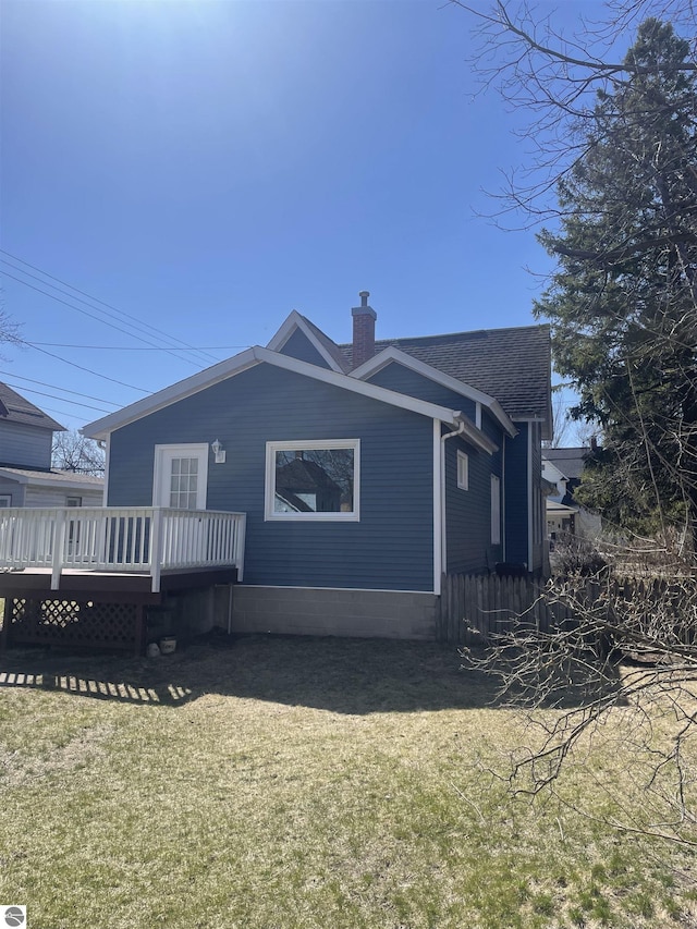 309 E Wisconsin, Mount Pleasant, MI 48858 - rear view of house with a deck and a chimney
