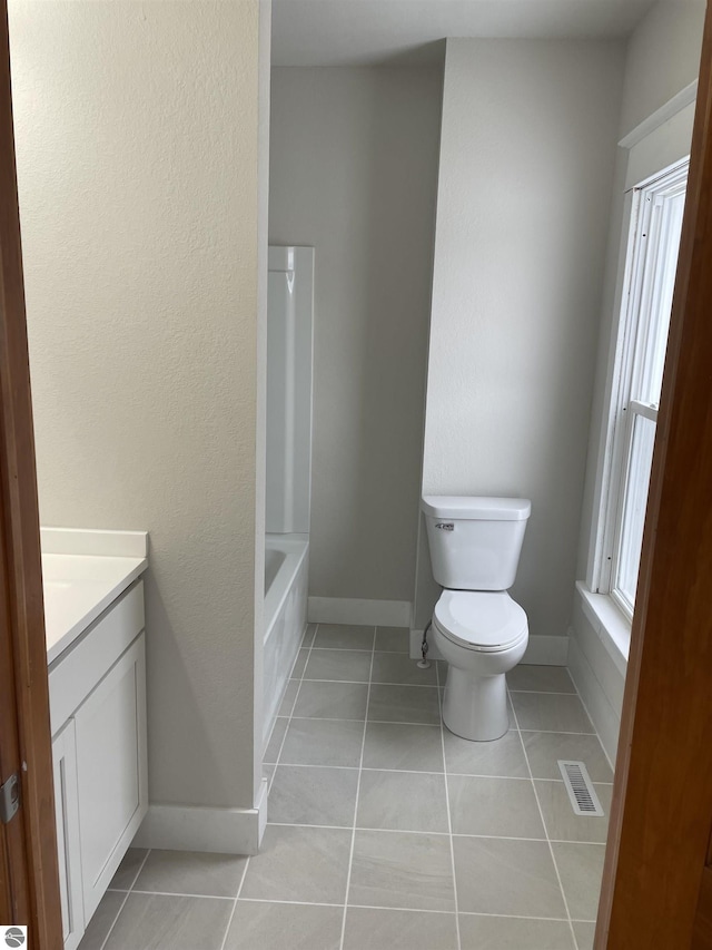 full bathroom featuring tile patterned floors, baseboards, visible vents, and vanity