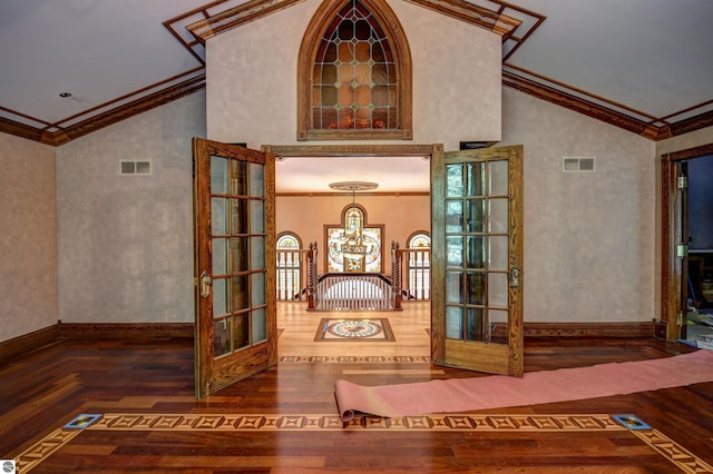 interior details featuring crown molding, french doors, and hardwood / wood-style flooring