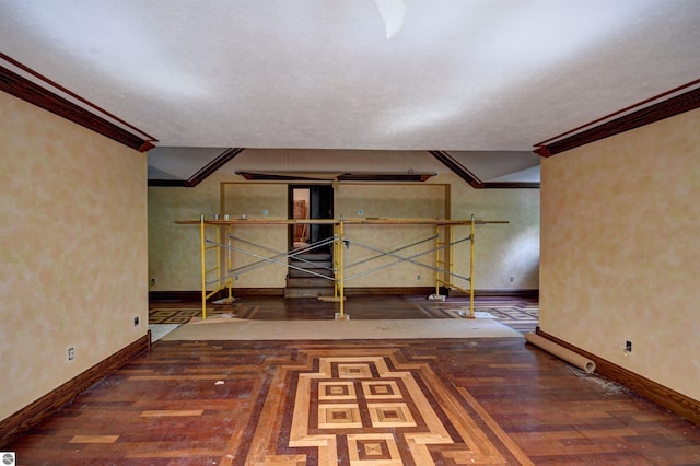 basement with crown molding and dark hardwood / wood-style floors