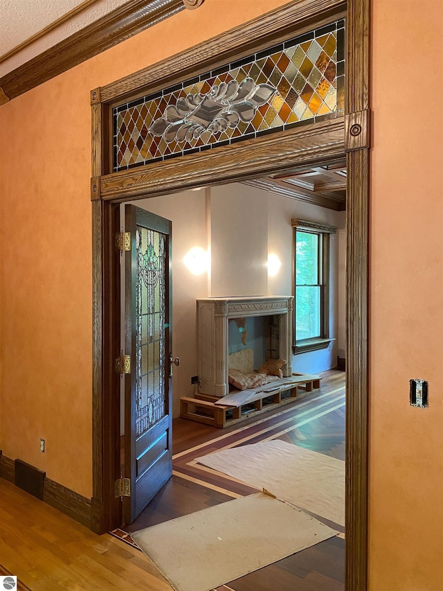 interior space featuring crown molding and hardwood / wood-style flooring