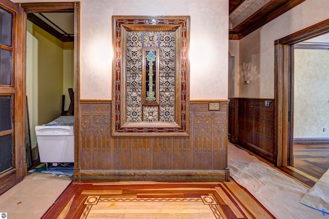 interior space featuring hardwood / wood-style flooring and crown molding