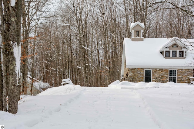 view of snow covered property