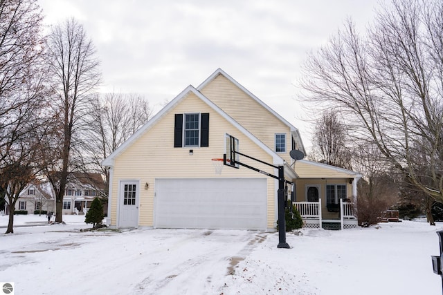 view of front of home featuring covered porch and a garage