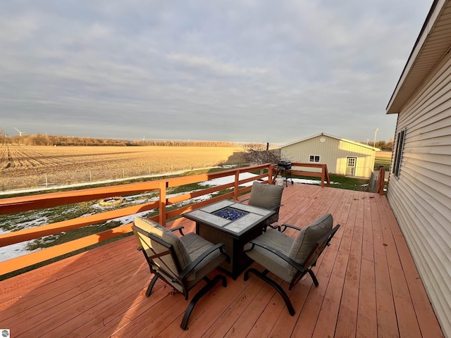 wooden deck with a rural view