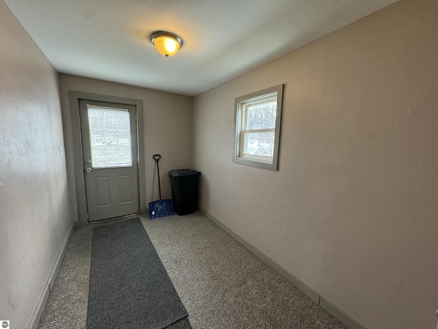 doorway with carpet flooring