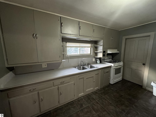 kitchen with sink and white range with gas cooktop