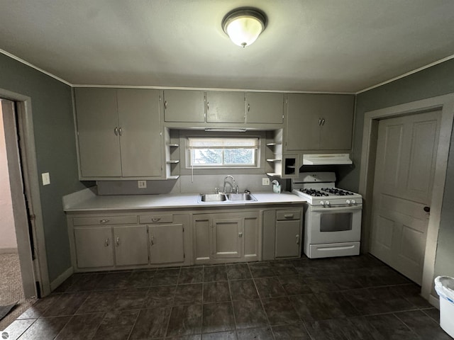 kitchen with white gas range and sink