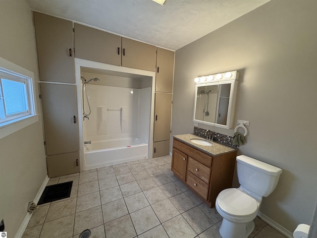 full bathroom with tile patterned floors, vanity, shower / bathtub combination, and toilet