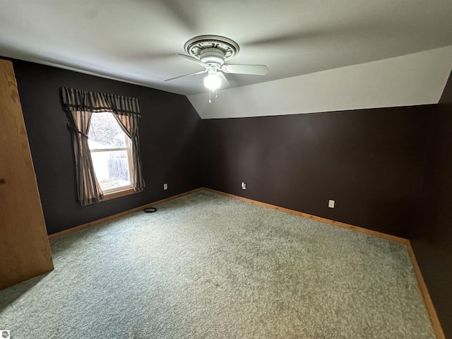 bonus room featuring ceiling fan, carpet, and lofted ceiling