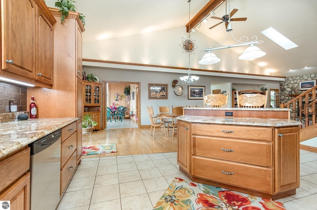 kitchen with ceiling fan with notable chandelier, lofted ceiling with skylight, decorative light fixtures, dishwasher, and light hardwood / wood-style floors