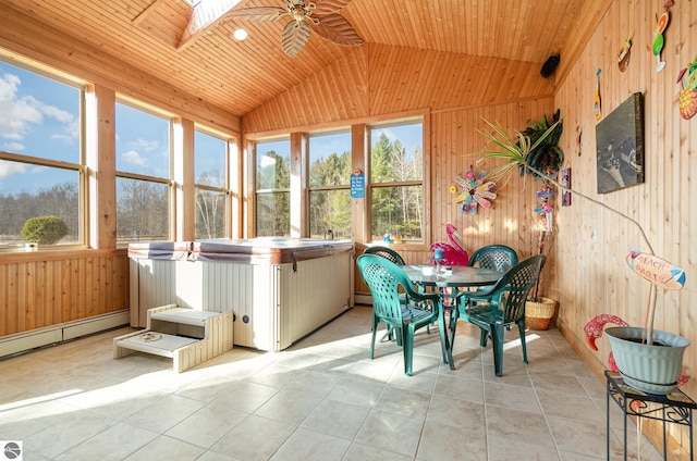 sunroom / solarium with ceiling fan, wood ceiling, a jacuzzi, and lofted ceiling with skylight