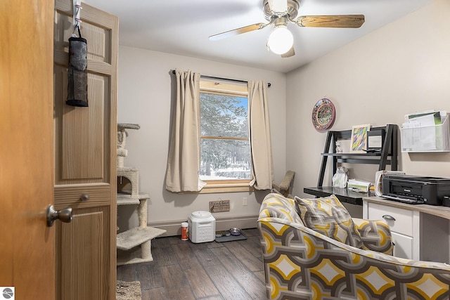 home office with dark hardwood / wood-style flooring and ceiling fan