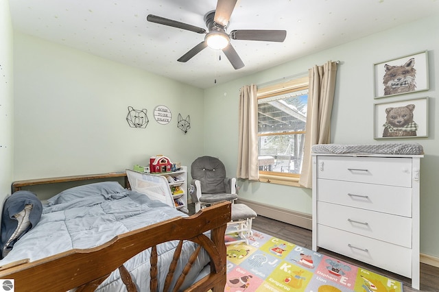 bedroom featuring hardwood / wood-style floors and ceiling fan