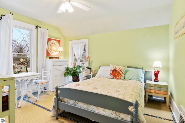 carpeted bedroom with lofted ceiling and a ceiling fan