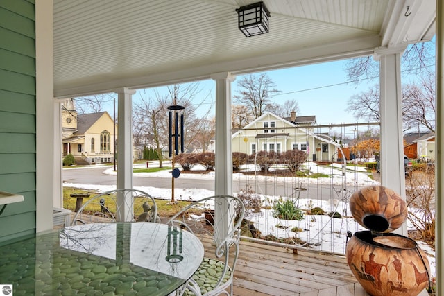 sunroom featuring a residential view
