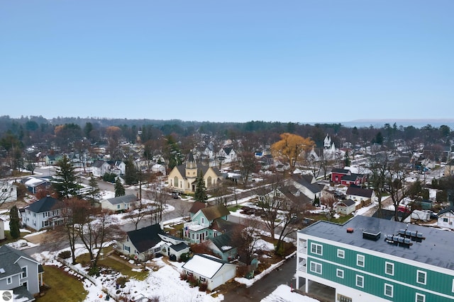 snowy aerial view featuring a residential view