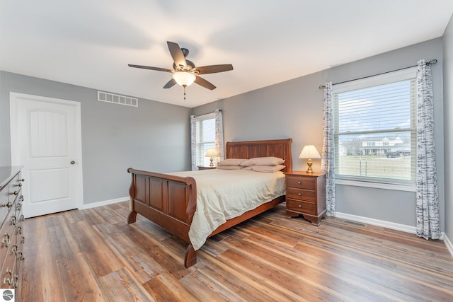 bedroom featuring ceiling fan and hardwood / wood-style floors