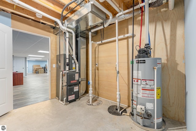 utility room featuring water heater