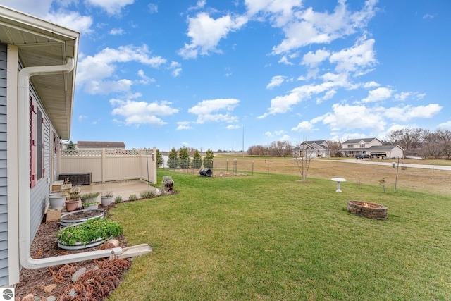 view of yard with an outdoor fire pit