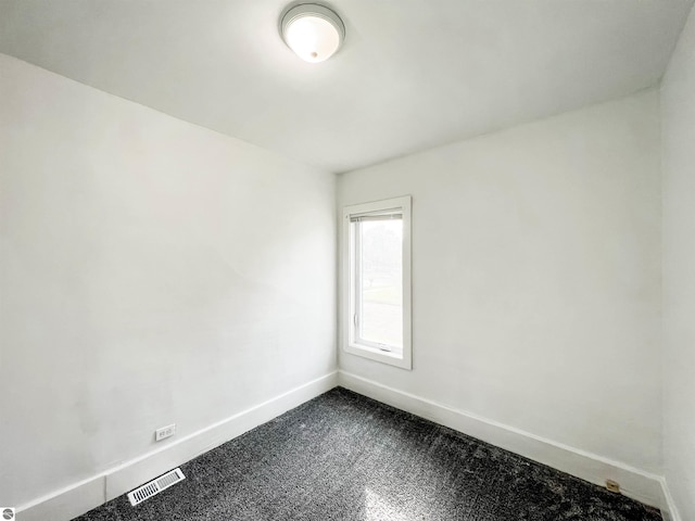 spare room with carpet floors