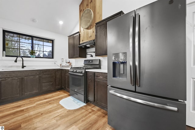 kitchen featuring black gas range, dark brown cabinetry, sink, light hardwood / wood-style flooring, and stainless steel fridge with ice dispenser