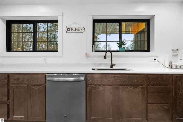 bar with dishwasher, dark brown cabinets, and sink