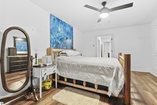 bedroom featuring ceiling fan and hardwood / wood-style floors