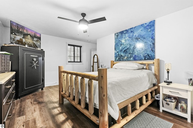 bedroom featuring ceiling fan and dark hardwood / wood-style flooring