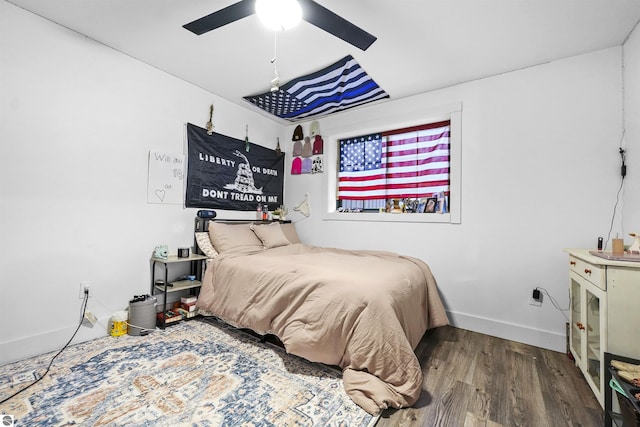 bedroom with ceiling fan and hardwood / wood-style floors