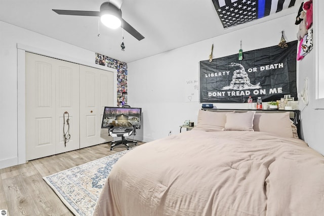 bedroom featuring wood-type flooring, a closet, and ceiling fan