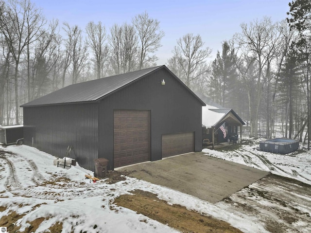 view of snow covered garage