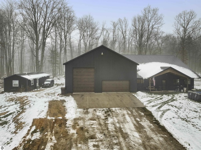 view of snow covered garage