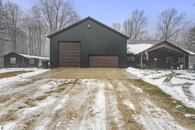 view of snow covered garage