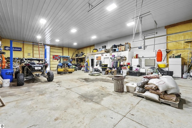 garage featuring white fridge