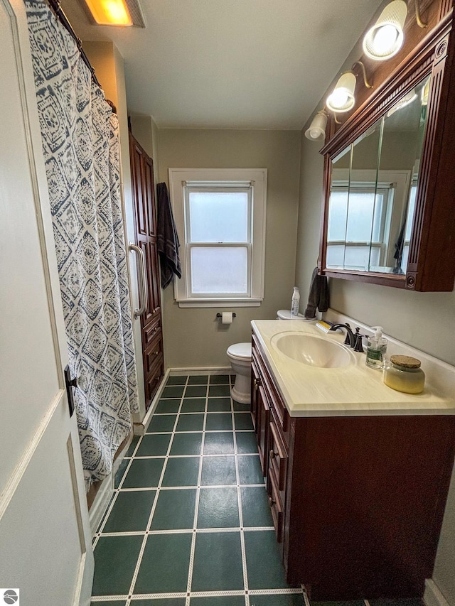 bathroom with vanity and toilet