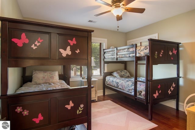 bedroom with wood-type flooring and ceiling fan