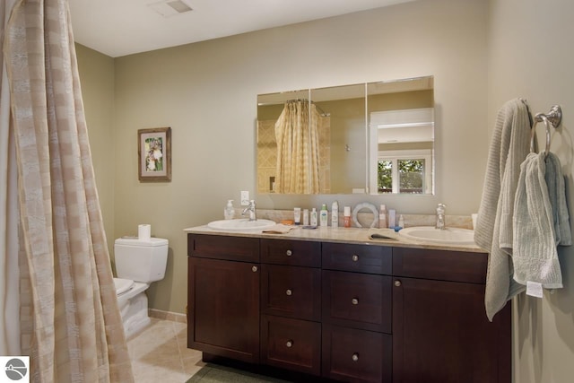 bathroom featuring tile patterned floors, vanity, toilet, and a shower with curtain