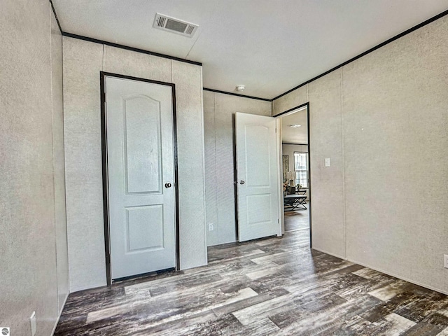 unfurnished bedroom featuring wood-type flooring